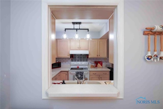 1932 Queenswood Dr Unit U5, Findlay, OH 45840 - kitchen with white electric range oven, under cabinet range hood, black microwave, decorative backsplash, and light brown cabinets