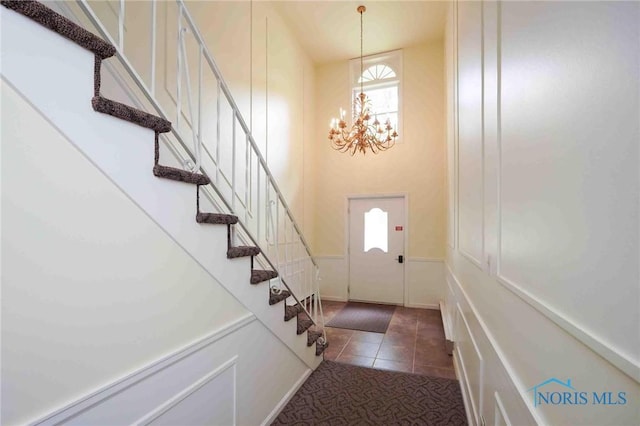 1932 Queenswood Dr Unit U5, Findlay, OH 45840 - foyer entrance featuring a chandelier, stairway, and tile patterned flooring