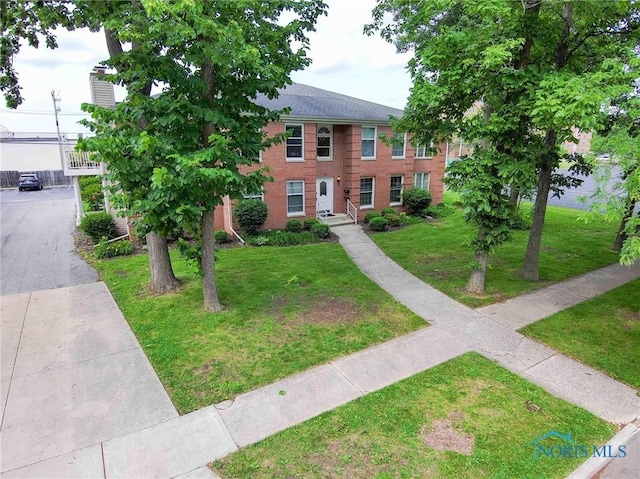 1932 Queenswood Dr Unit U5, Findlay, OH 45840 - view of front of house with brick siding and a front lawn