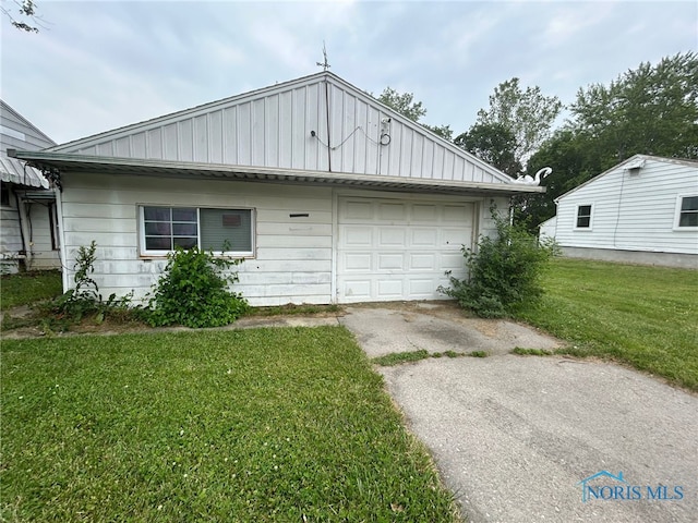 111 Bertha Ave, Clyde, OH 43410 - view of front facade with driveway, a front lawn, and a garage