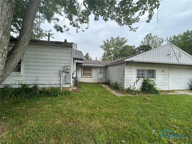 111 Bertha Ave, Clyde, OH 43410 - view of grassy yard featuring a garage