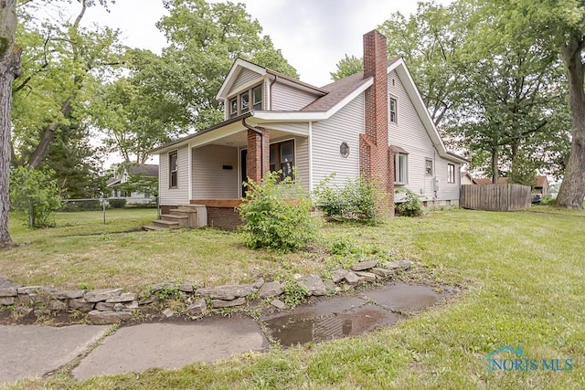 1302 Laning Rd, Toledo, OH 43615 - view of front of property featuring a chimney and covered porch