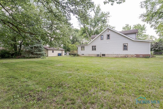 1302 Laning Rd, Toledo, OH 43615 - back of property featuring crawl space and a lawn