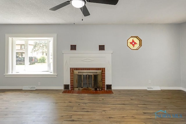 1302 Laning Rd, Toledo, OH 43615 - unfurnished living room featuring wood finished floors, a ceiling fan, and a fireplace