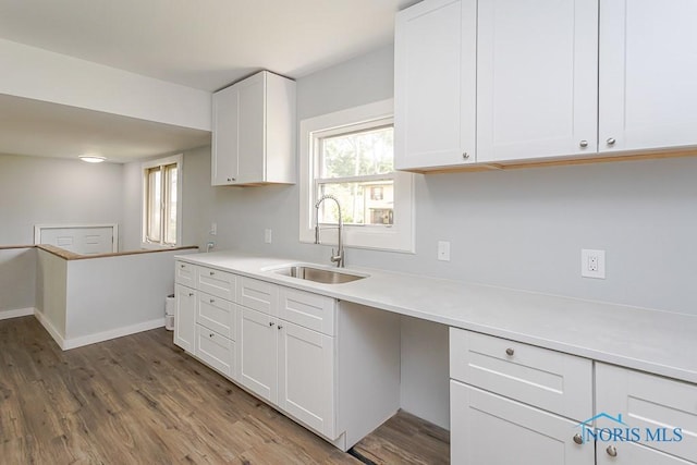 1302 Laning Rd, Toledo, OH 43615 - kitchen featuring wood finished floors, white cabinetry, and light countertops
