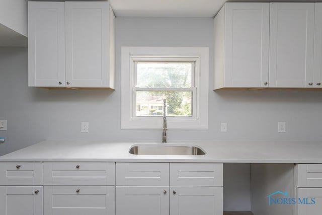 1302 Laning Rd, Toledo, OH 43615 - kitchen with white cabinets and light countertops