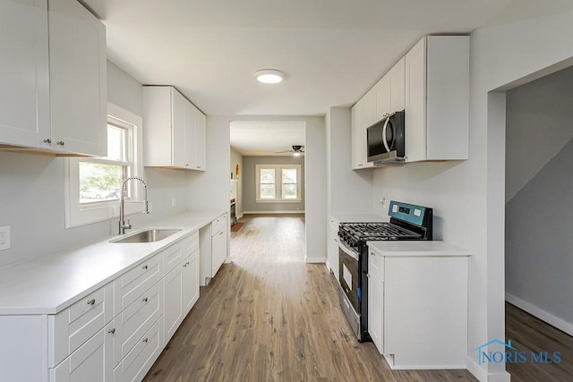 1302 Laning Rd, Toledo, OH 43615 - kitchen featuring appliances with stainless steel finishes, wood finished floors, and plenty of natural light