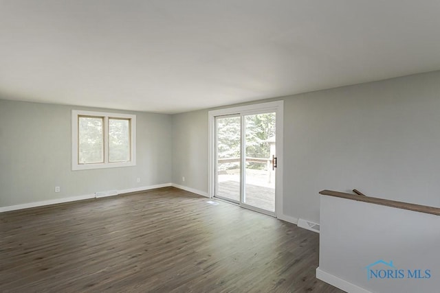 1302 Laning Rd, Toledo, OH 43615 - spare room with healthy amount of natural light and dark wood-type flooring