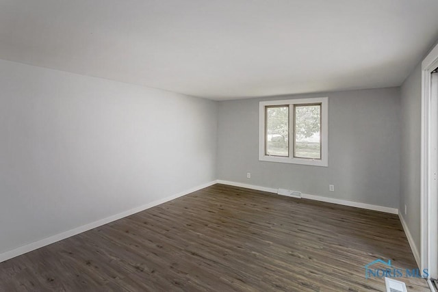 1302 Laning Rd, Toledo, OH 43615 - spare room with dark wood finished floors and baseboards