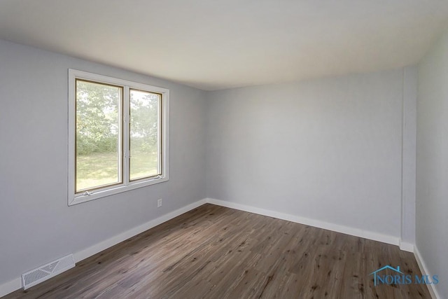 1302 Laning Rd, Toledo, OH 43615 - empty room with dark wood-style floors and baseboards