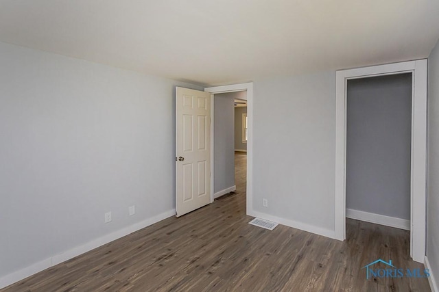 1302 Laning Rd, Toledo, OH 43615 - unfurnished bedroom featuring wood finished floors and baseboards