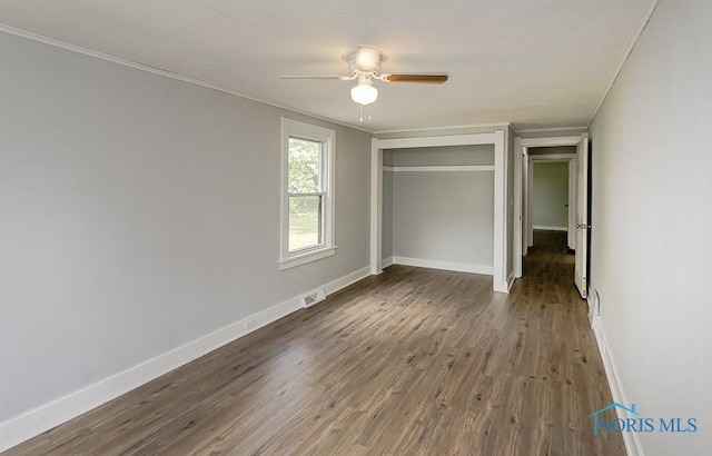 1302 Laning Rd, Toledo, OH 43615 - unfurnished bedroom with wood finished floors, crown molding, a closet, and ceiling fan