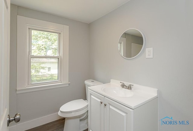 1302 Laning Rd, Toledo, OH 43615 - half bathroom featuring vanity and wood finished floors
