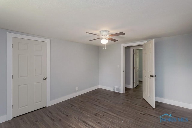 1302 Laning Rd, Toledo, OH 43615 - unfurnished room featuring a ceiling fan and dark wood-style floors