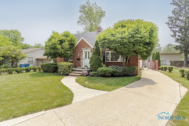 160 Wilkshire Dr, Waterville, OH 43566 - tudor house with brick siding and a front yard