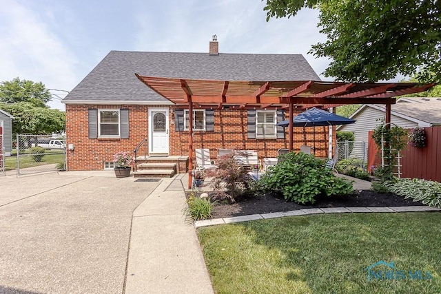 160 Wilkshire Dr, Waterville, OH 43566 - view of front of home featuring roof with shingles, a pergola, brick siding, a chimney, and entry steps