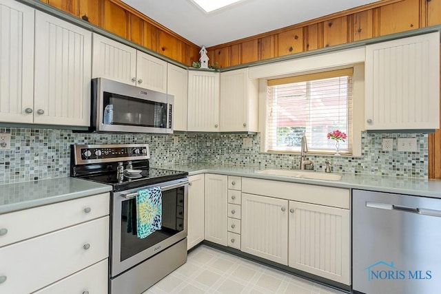 160 Wilkshire Dr, Waterville, OH 43566 - kitchen with stainless steel appliances, light countertops, and decorative backsplash