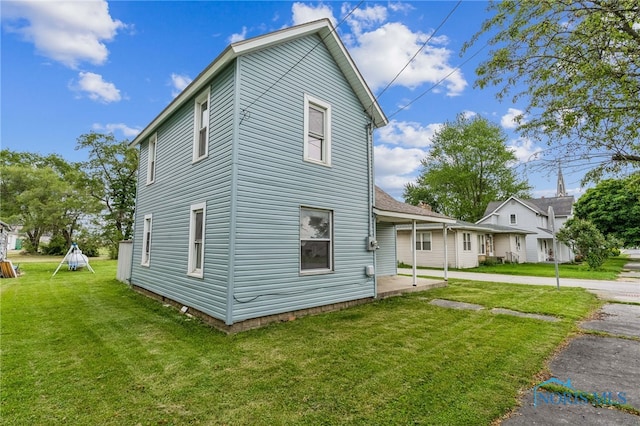 22856 Main St, Custar, OH 43511 - view of home's exterior with a lawn and a patio area