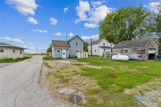 22856 Main St, Custar, OH 43511 - view of grassy yard with a shed