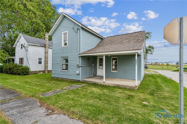 22856 Main St, Custar, OH 43511 - rear view of house with a yard and roof with shingles