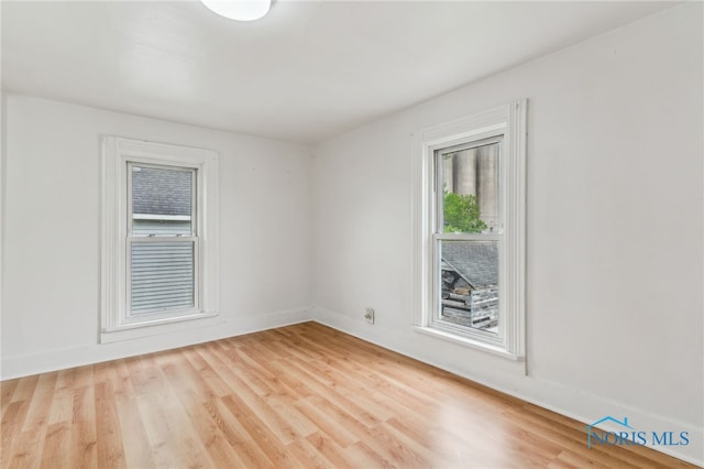 22856 Main St, Custar, OH 43511 - empty room with light wood-type flooring and baseboards