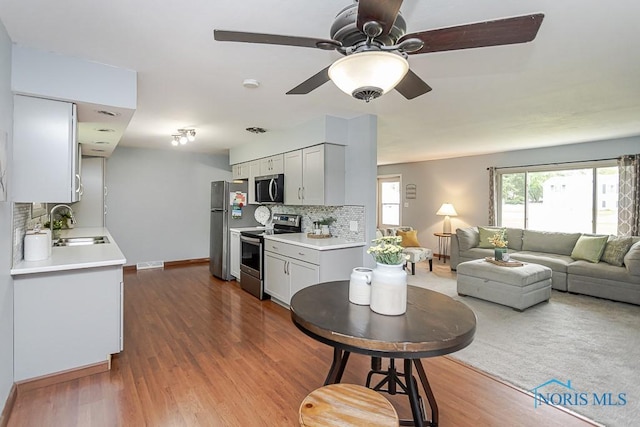 2941 Seaman Rd, Oregon, OH 43616 - living room featuring wood finished floors and ceiling fan
