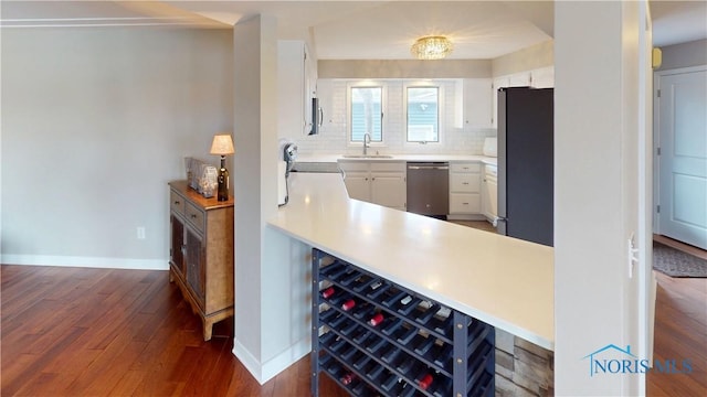 2109 Ottawa River Rd Unit 3C, Toledo, OH 43611 - bar with appliances with stainless steel finishes, dark wood-style flooring, and tasteful backsplash
