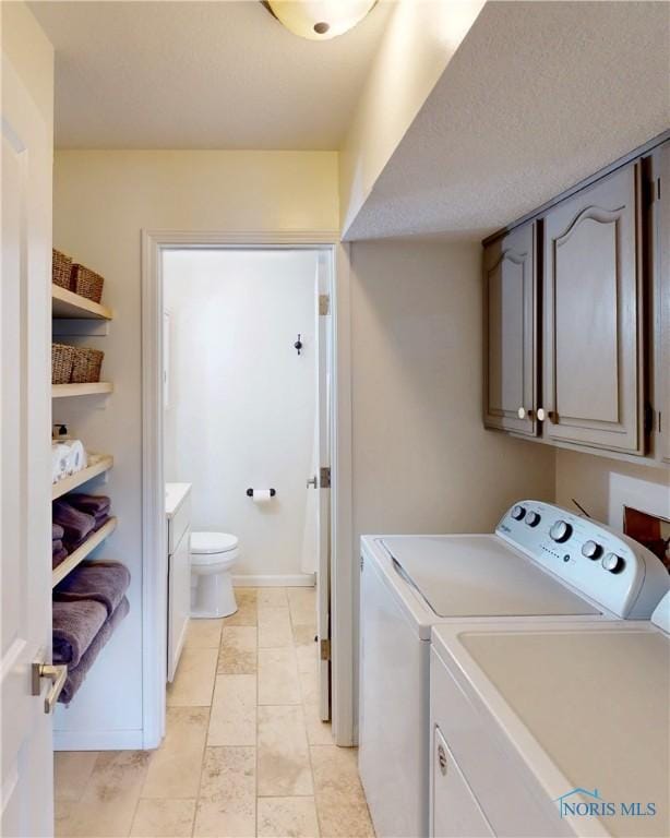 2109 Ottawa River Rd Unit 3C, Toledo, OH 43611 - washroom featuring separate washer and dryer and cabinet space