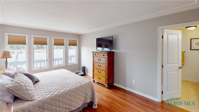 2109 Ottawa River Rd Unit 3C, Toledo, OH 43611 - bedroom with baseboards and light wood-style flooring