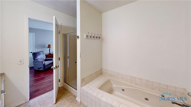 2109 Ottawa River Rd Unit 3C, Toledo, OH 43611 - ensuite bathroom featuring a jetted tub and a shower stall
