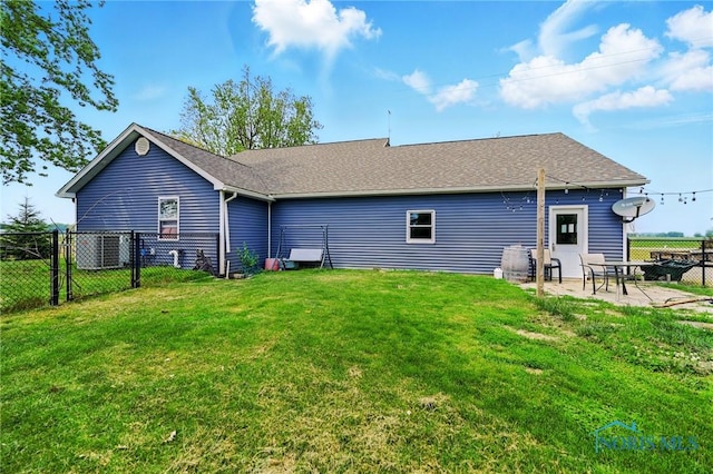 12505 Bloomlock Rd, Delphos, OH 45833 - back of house featuring a patio and roof with shingles