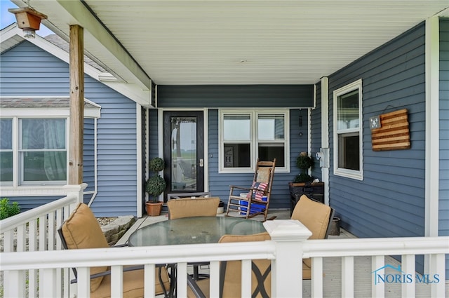 12505 Bloomlock Rd, Delphos, OH 45833 - covered porch with outdoor dining area