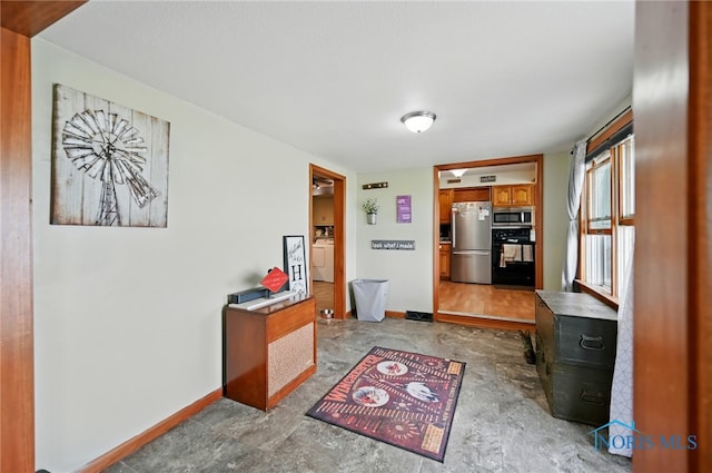 12505 Bloomlock Rd, Delphos, OH 45833 - hallway featuring washer / clothes dryer and baseboards