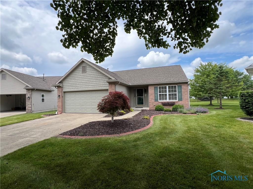 4511 Harbour Creek Ct, Maumee, OH 43537 - ranch-style home featuring brick siding, an attached garage, driveway, a front lawn, and a shingled roof