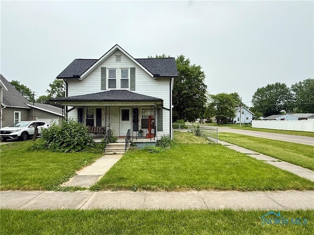 613 Maplewood Ave, Delta, OH 43515 - view of front facade with a porch and roof with shingles