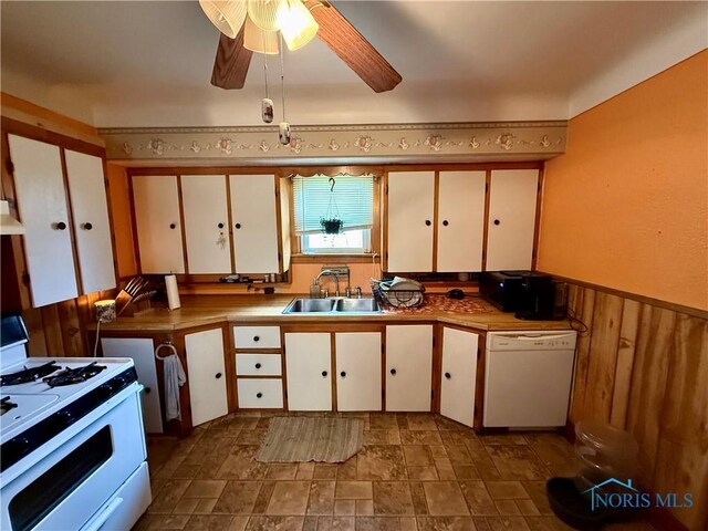 613 Maplewood Ave, Delta, OH 43515 - kitchen featuring white appliances, stone finish floors, white cabinets, ventilation hood, and wainscoting