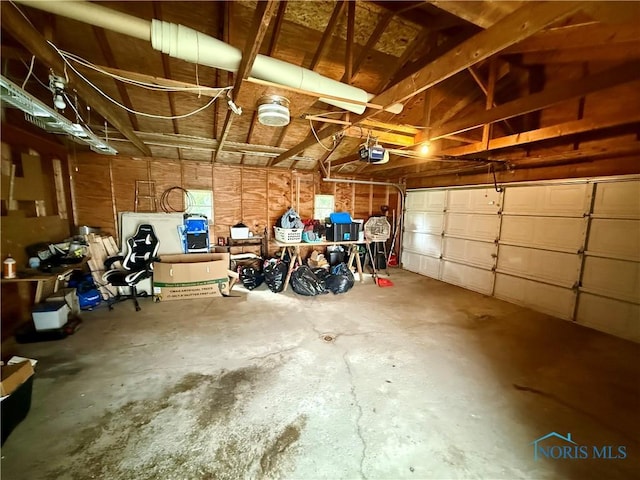 613 Maplewood Ave, Delta, OH 43515 - garage featuring a garage door opener