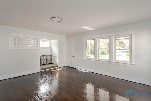 1385 Berdan Ave, Toledo, OH 43612 - unfurnished living room featuring baseboards and wood finished floors