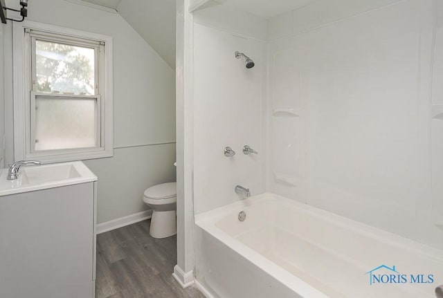 1385 Berdan Ave, Toledo, OH 43612 - bathroom featuring wood finished floors, vaulted ceiling, shower / bath combination, and vanity