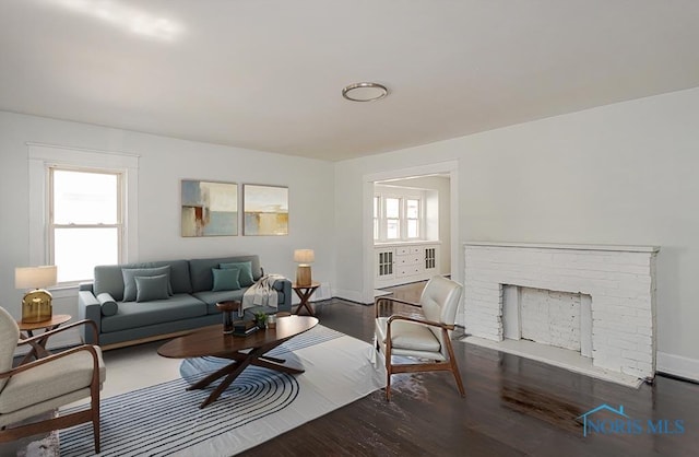1385 Berdan Ave, Toledo, OH 43612 - living room with wood finished floors and a brick fireplace