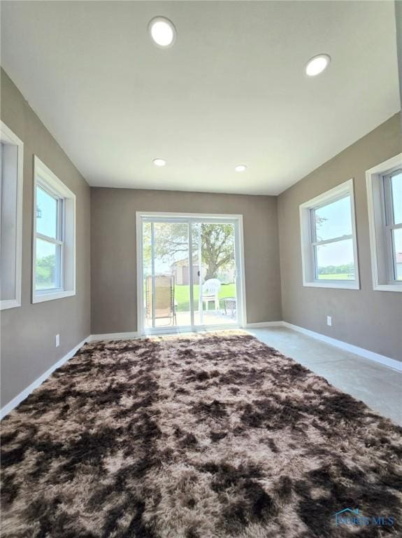 17738 County Rd E, Bryan, OH 43506 - spare room with healthy amount of natural light, recessed lighting, and carpet flooring