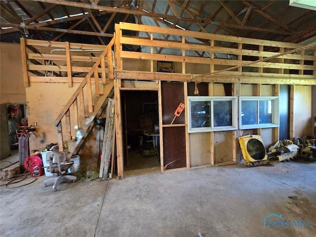 17738 County Rd E, Bryan, OH 43506 - miscellaneous room featuring vaulted ceiling and stairs