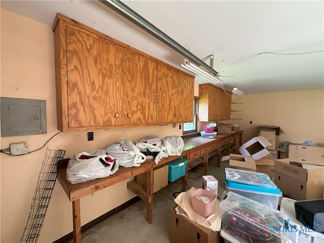 5916 E Benalex Dr, Toledo, OH 43612 - kitchen featuring brown cabinets, unfinished concrete floors, and electric panel