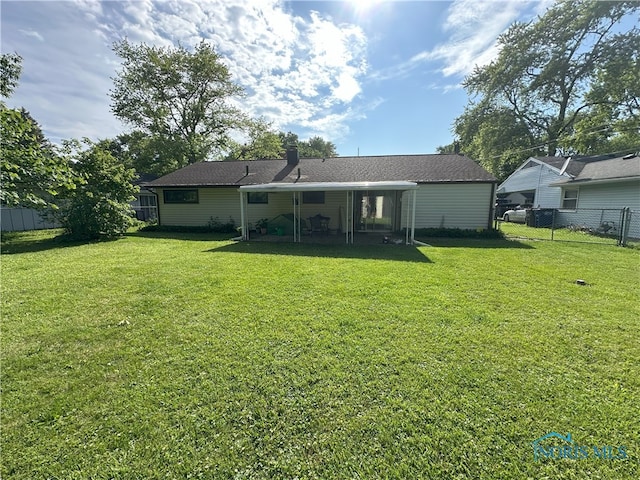 5916 E Benalex Dr, Toledo, OH 43612 - back of property featuring a chimney