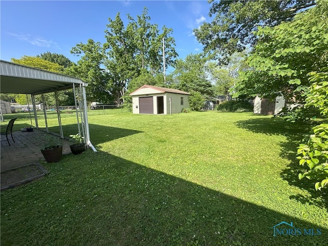 5916 E Benalex Dr, Toledo, OH 43612 - fenced backyard with a detached garage and a shed