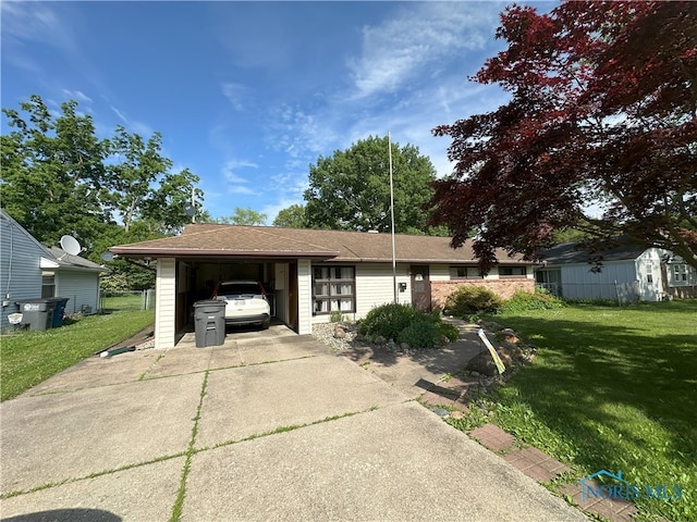 5916 E Benalex Dr, Toledo, OH 43612 - view of front of house with concrete driveway and a front lawn