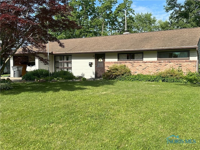 5916 E Benalex Dr, Toledo, OH 43612 - ranch-style home with brick siding, a front lawn, and roof with shingles