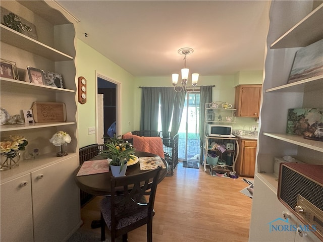 5916 E Benalex Dr, Toledo, OH 43612 - dining room featuring a chandelier, light wood-type flooring, and heating unit