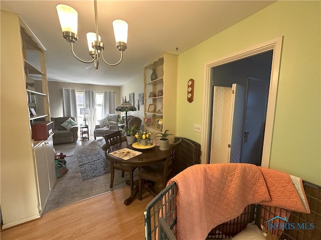 5916 E Benalex Dr, Toledo, OH 43612 - dining space featuring a chandelier and wood finished floors