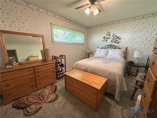 5916 E Benalex Dr, Toledo, OH 43612 - carpeted bedroom with wallpapered walls and a ceiling fan